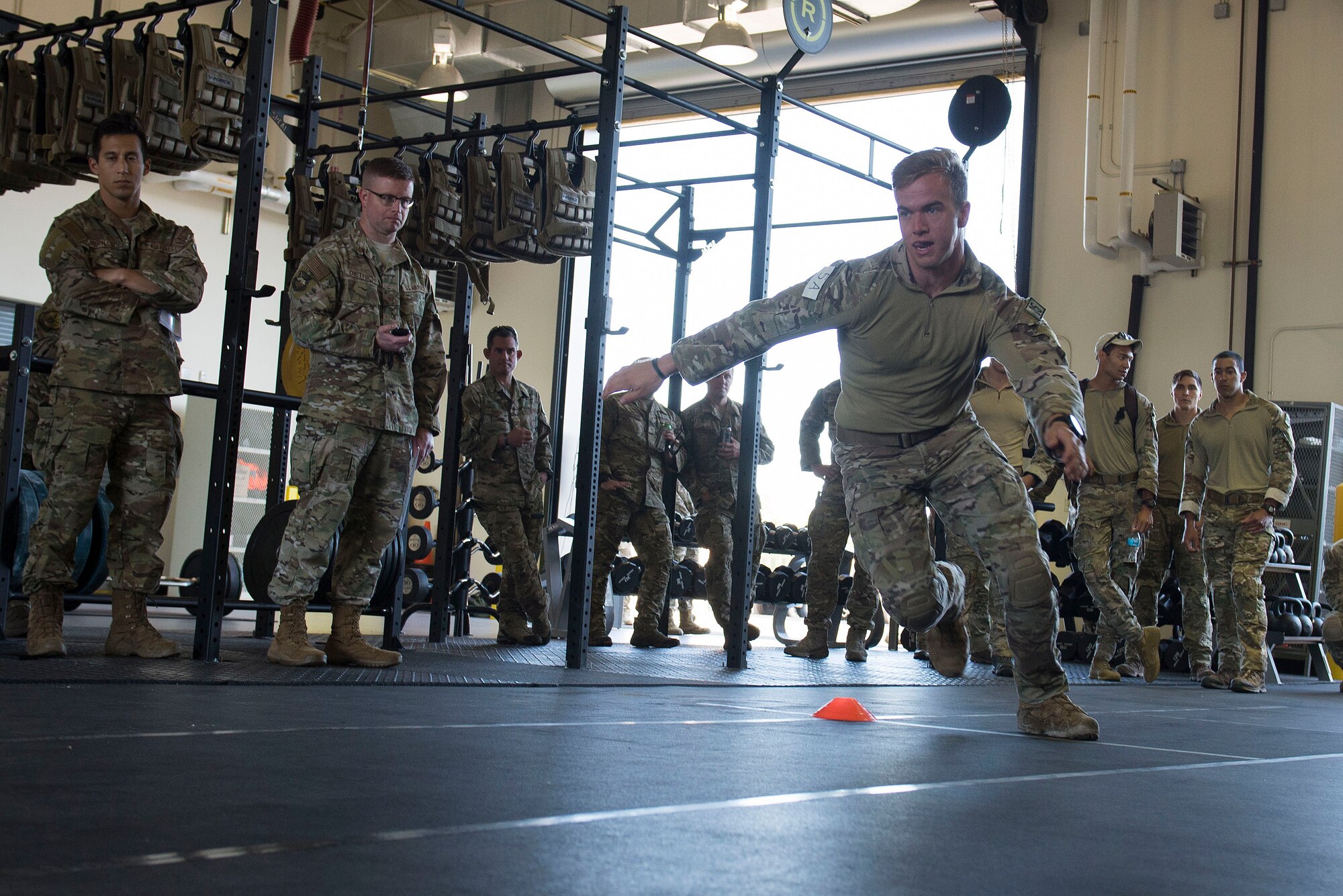 A U.S. Air Force Tactical Air Control Party (TACP) Airman assigned to the 9th Air Support Operations Squadron, Ford Hood, Texas, performs a timed two-cone drill as part of a Tier II Operator Fitness Test during the 2019 Lightning Challenge at Joint Base Lewis-McChord, Wash., July 29, 2019.