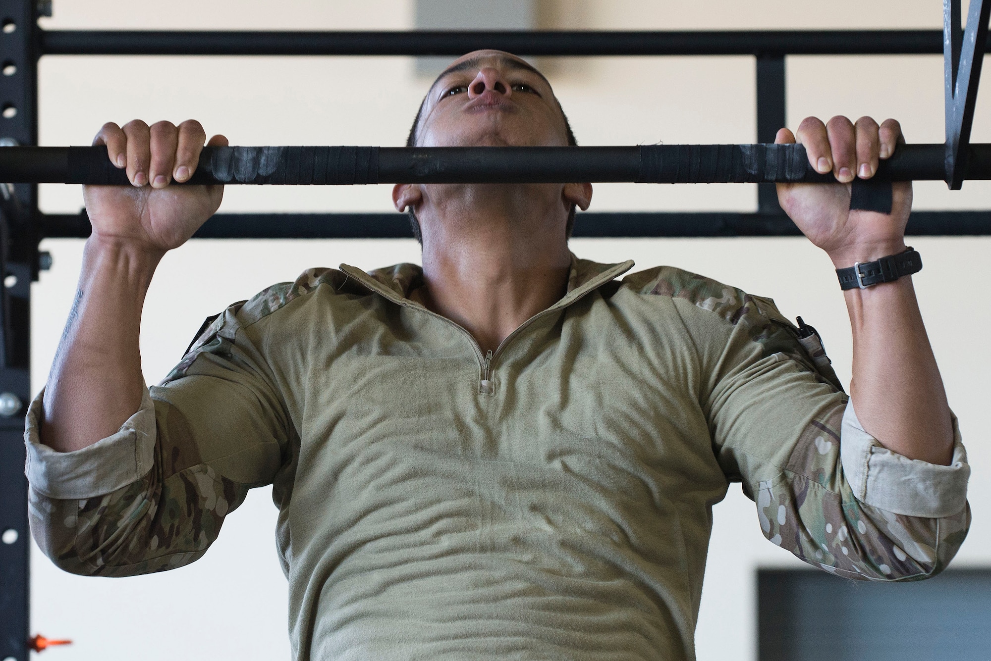 A U.S. Air Force Tactical Air Control Party Airman assigned to the 10th Air Support Operations Squadron, Fort Riley, Kansas, performs pull-ups as part of a Tier II Operator Fitness Test during the 2019 Lightning Challenge at Joint Base Lewis-McChord, Wash., July 29, 2019.