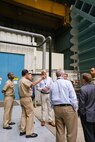 Program Executive Officer for Submarines Rear Adm. David Goggins (second from left) discusses the Large Cavitation Channel (LCC) with Commanding Officer Capt. Cedric McNeal, Site Director Matthew Brantz and Naval Architecture and Engineering Department Head Mike Brown during a tour of the facility in Memphis, Tenn., on July 23, 2019. The LCC is a detachment of Naval Surface Warfare Center, Carderock Division, headquartered in West Bethesda, Md. (U.S. Navy photo by Katie Ellis-Warfield/Released)
