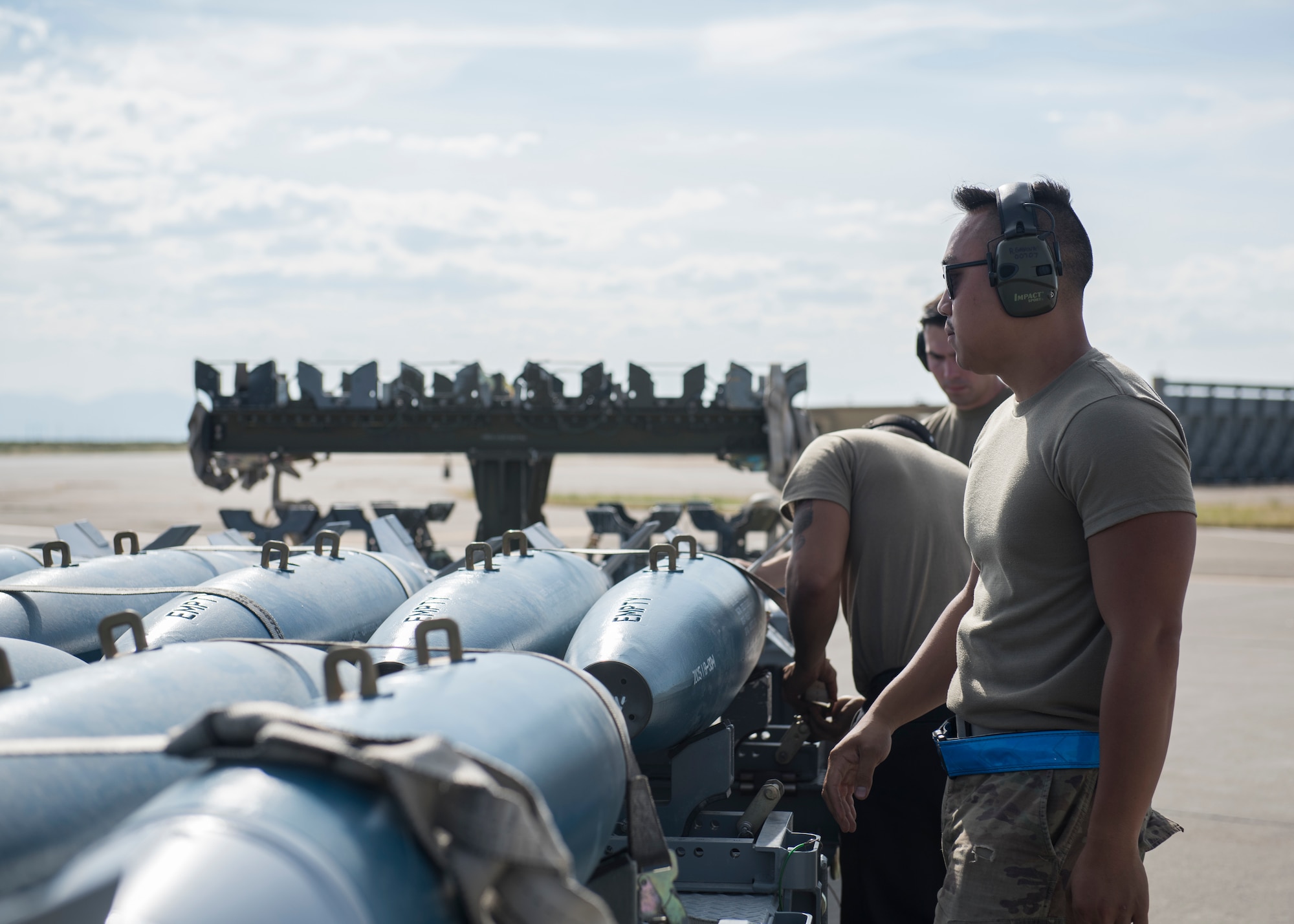 Weapons load crew chiefs from the 391st Fighter squadron prepare to load training eqipment onto an F-15E Strike Eagle during the Adaptive Basing exercise July 17, 2019 at Mountain Home Air Force Base. Weapons load crew chiefs play a vital role in down-range missions, as they are charged with making sure fighter aircraft are re-armed efficiently to continue the fight. (U.S. Air Force photo by Senior Airman Tyrell Hall)