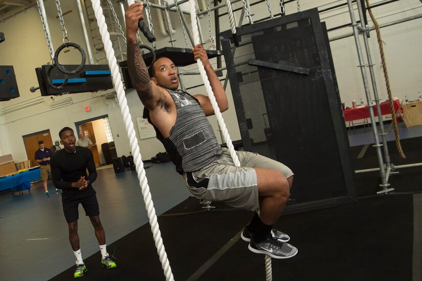 U.S. Air Force Staff Sgt. Sherod Ellis, 1st Airlift Squadron, Andrews Air Force Base, Md., traverses Joint Base Charleston Fitness Center’s battle rig obstacles during the Alpha Warrior Super Regional event July 27, 2019, at Joint Base Charleston, S.C. Twelve Airmen competed, tackling a variety of functional fitness obstacles, while utilizing the Joint Base Charleston Fitness Center’s Alpha Warrior battle rig. The competition focuses on a competitor’s overall readiness and is designed to promote more fit and resilient service members.