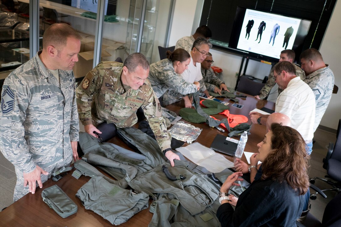 Aircrew Flight Equipment Airmen from the 154th and 15th Operations Support Squadrons examine the latest installments of equipment July 8, 2019 at Joint Base Pearl Harbor-Hickam, Hawaii.