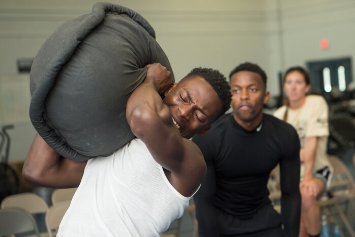 U.S. Air Force Senior Airman Akil Tubbs, a reservist with the 914th Force Support Squadron, Niagara Falls Air Reserve Station, N.Y., lifts a 100-pound sandbag during the Alpha Warrior Super Regional event July 27, 2019, at Joint Base Charleston, S.C. Twelve Airmen competed, tackling a variety of functional fitness obstacles, while utilizing the Joint Base Charleston Fitness Center’s Alpha Warrior battle rig. The competition focuses on a competitor’s overall readiness and is designed to promote more fit and resilient service members.