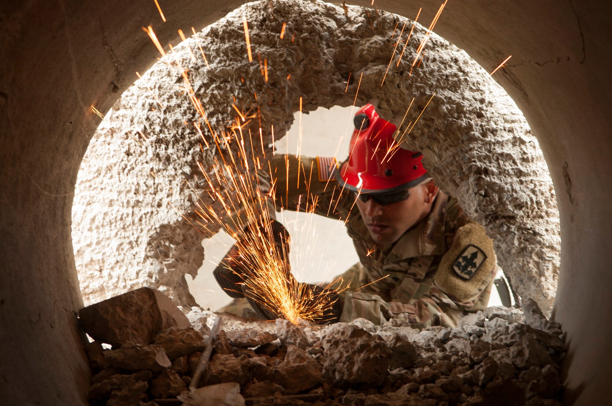 Hawaii Army National Guard Spc. Tyson Ortiz breaks through concrete and reinforced steel as part of the Combined - Multinational Task Force (CTF 501) search and extraction training scenario on July 18, 2019 at Kalaeloa Urban Search and Rescue Training area, Hawaii.