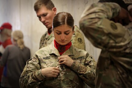 Army Reserve Sgt. Maribel Meraz, 85th U.S. Army Reserve Support Command headquarters color guard non-commissioned officer-in-charge, prepares to conduct the presentation of colors with her color guard team at  the American Association of Independent Professional Baseball’s Chicago Dogs baseball home game, July 28, 2019, at Impact Field in Rosemont, Illinois against the Cleburne Railroaders.