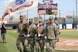 An Army Reserve color guard team, assigned to the 85th U.S. Army Reserve Support Command headquarters, present the Nation’s Colors during the American Association of Independent Professional Baseball’s Chicago Dogs baseball home game, July 28, 2019, at Impact Field in Rosemont, Illinois against the Cleburne Railroaders.