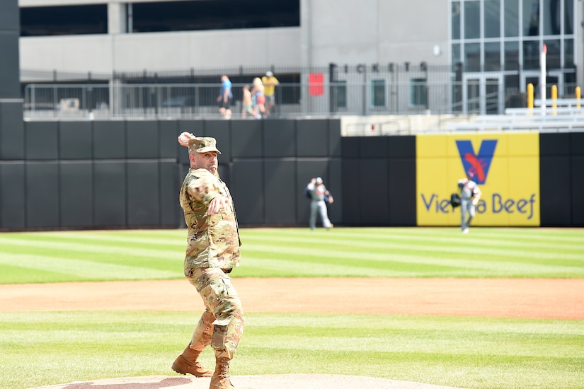 Army Reserve Col. Daniel Jaquint, assigned to the 85th U.S. Army Reserve Support Command headquarters, throws out a first pitch during the American Association of Independent Professional Baseball’s Chicago Dogs baseball home game, July 28, 2019, at Impact Field in Rosemont, Illinois against the Cleburne Railroaders.