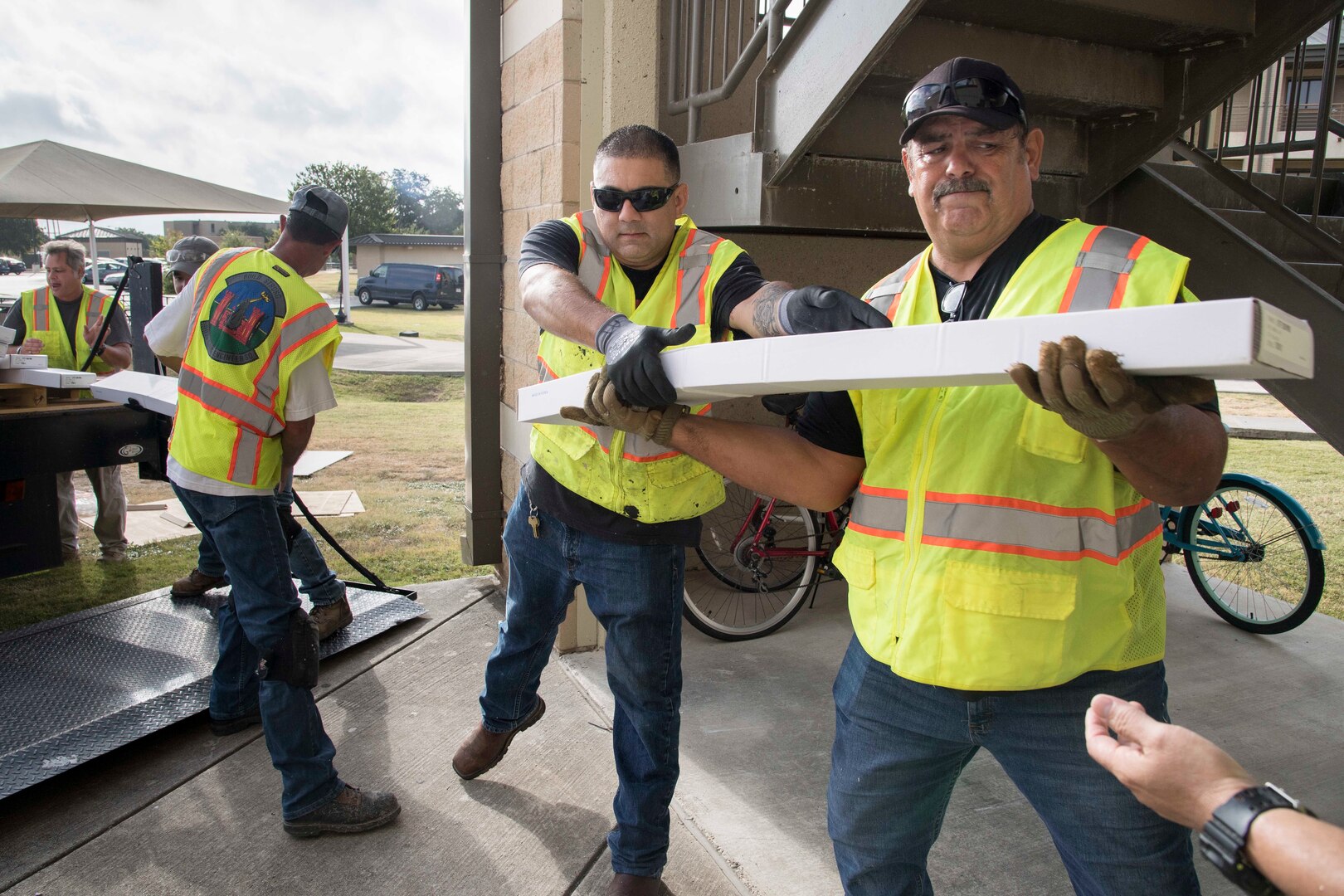 Professionals from the 502nd Air Base Wing Civil Engineer Group work to remediate dorms with mold July 29 at Joint Base San Antonio–Lackland. The mold remediation is taking place after Airmen at JBSA-Lackland voiced their concerns.