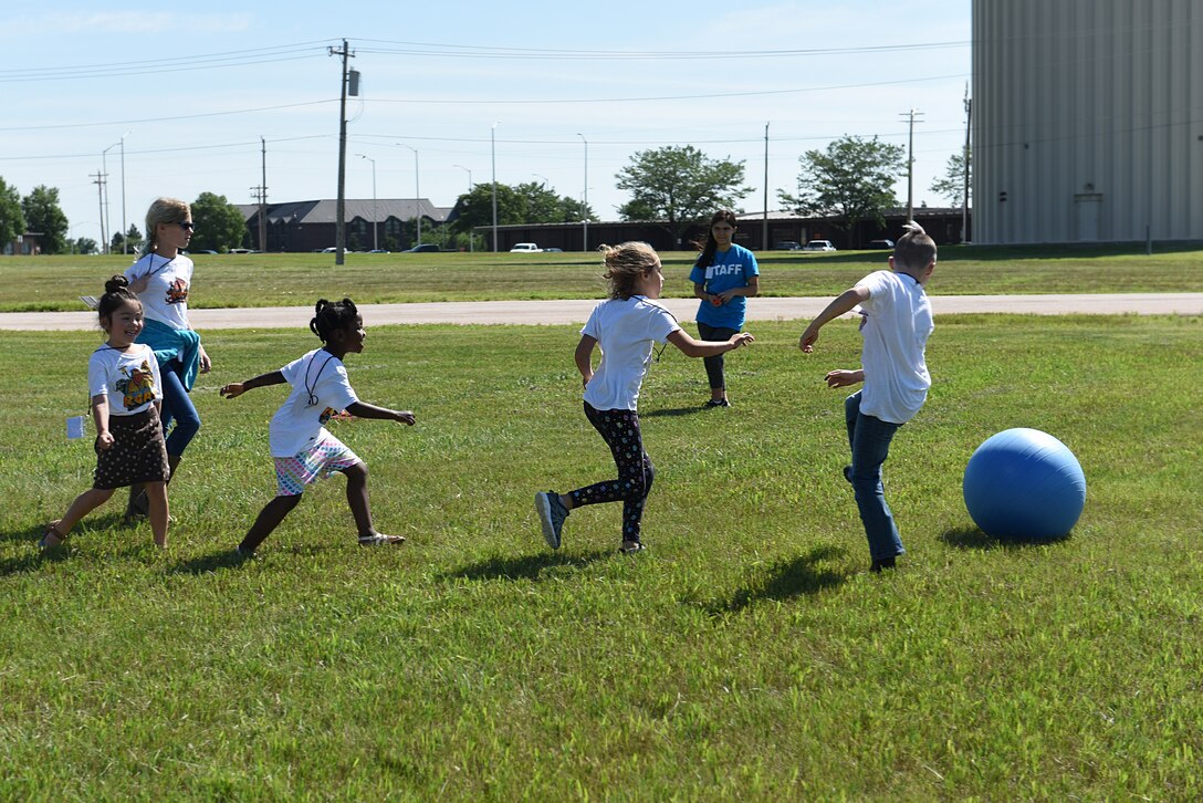 Children play outside at Vacation Bible School at the Chapel Community Center at Ellsworth Air Force Base, S.D., July 21, 2019. The activity allows children, ages 6 through 12, to enjoy the outdoors during the summer. (U.S. Air Force photo by Airman Quentin K. Marx)