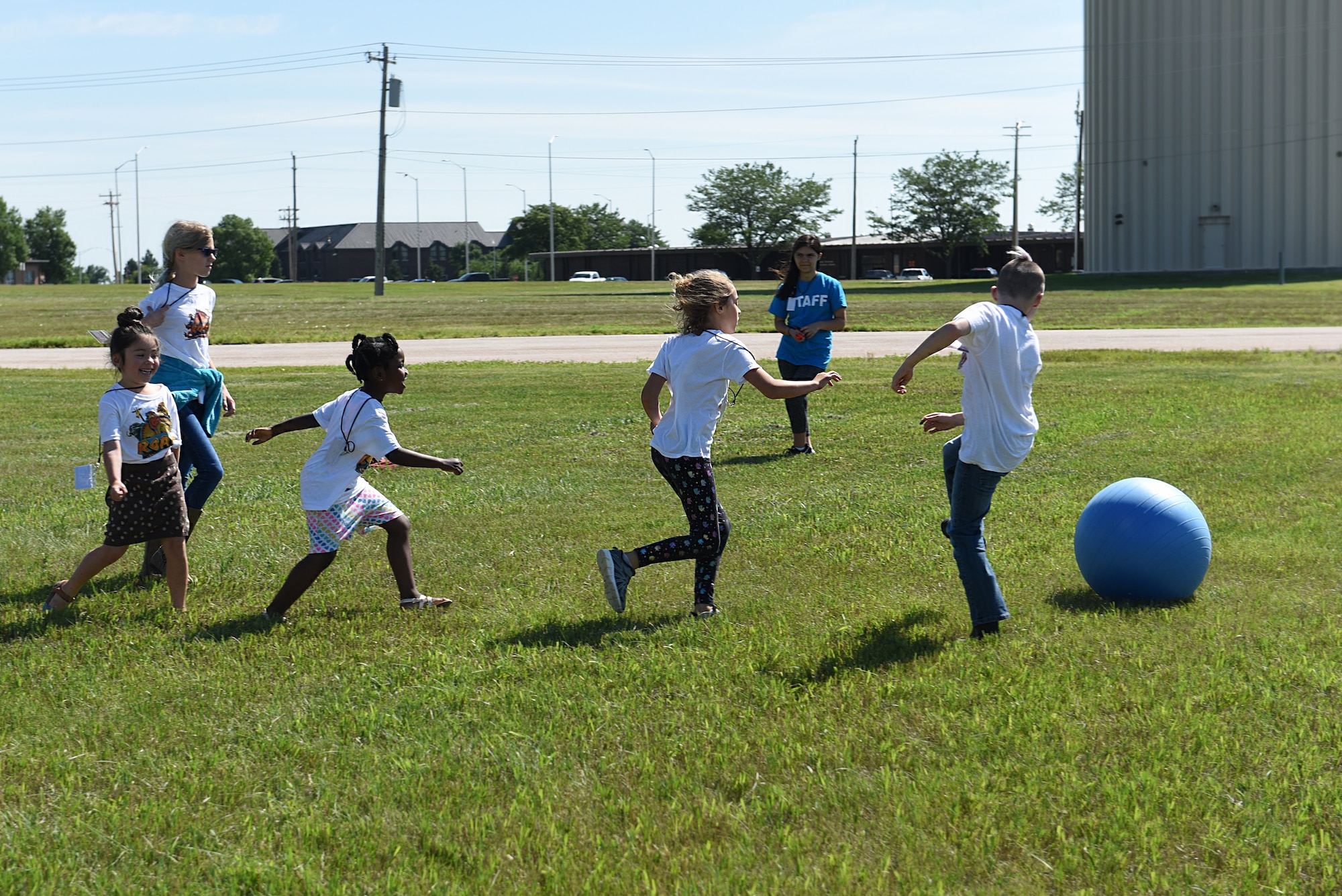 Children play outside at Vacation Bible School at the Chapel Community Center at Ellsworth Air Force Base, S.D., July 21, 2019. The activity allows children, ages 6 through 12, to enjoy the outdoors during the summer. (U.S. Air Force photo by Airman Quentin K. Marx)