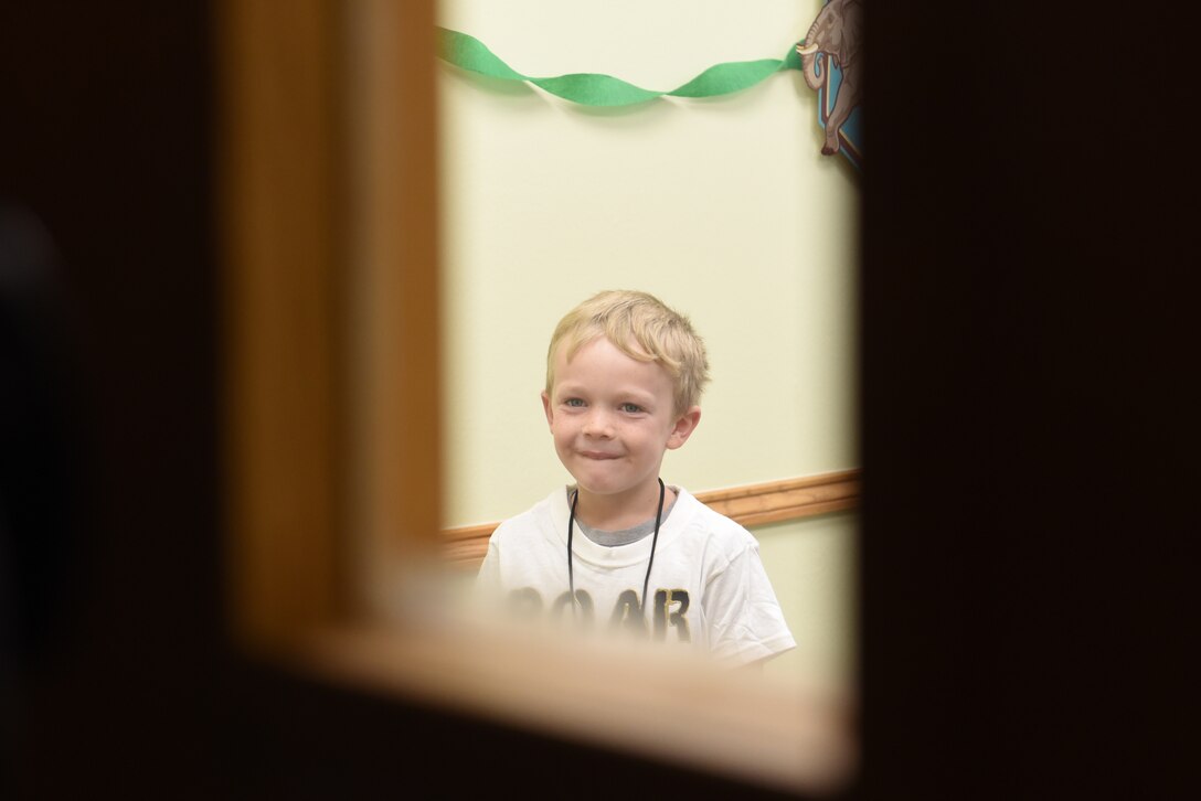 A child listens to a lesson at Vacation Bible School at the Chapel Community Center at Ellsworth Air Force Base, S.D., July 21, 2019. Children learned about faith and how it can help people face struggles in life, such as fear or change. (U.S. Air Force photo by Airman Quentin K. Marx)