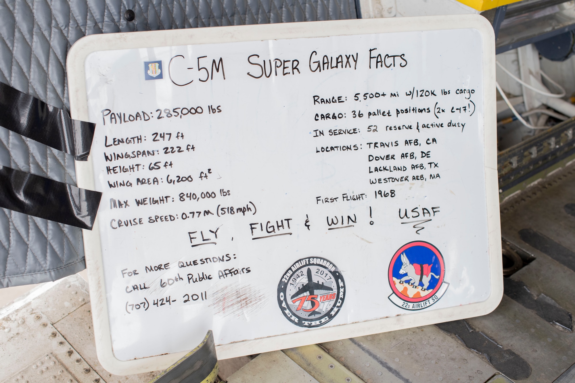 An information board about the C-5M Super Galaxy sits displayed inside the aircraft July 26, 2019, at Whitman Regional Airport in Oshkosh, Wisconsin. The C-5 crew went to EAA AirVenture 2019 where more than 500,000 aviation enthusiasts from 80 countries gathered at the air show to celebrate the past, present and future in the world of aviation. (U.S. Air Force photo by Senior Airman Jonathon Carnell)