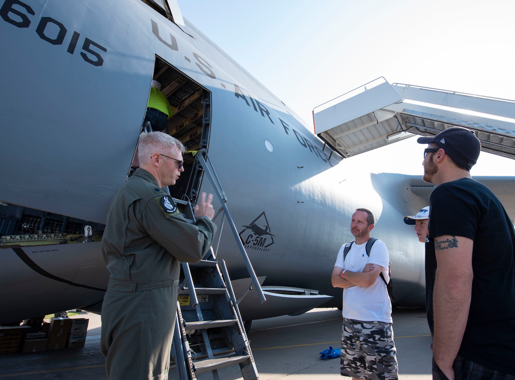 U.S. Air Force Lt. Col. Brian M. Trumble, 22nd Airlift Squadron director of operations and instructor pilot, speaks with aviation enthusiasts about the C-5M Super Galaxy July 27, 2019, at Wittman Regional Airport in Oshkosh, Wisconsin. The C-5 crew went to EAA AirVenture 2019 where more than 500,000 aviation enthusiasts from 80 countries gathered at the air show to celebrate the past, present and future in the world of aviation. (U.S. Air Force photo by Senior Airman Jonathon Carnell)