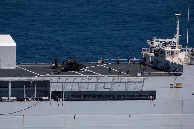 A UH-60 Blackhawk assigned to the 1st Battalion 228th Aviation Regiment lands on to U.S. Naval Ship Comfort during deck landing qualifications July 20, 2019, off the coast of Punta Arenas Costa Rica. U.S. Army Helicopter pilots and crew members of Joint Task Force –Bravo completed qualifications July 18-26 to support an upcoming mission, off the coast of Punta Arenas, Costa Rica. (U.S. Air Force photo by Staff Sgt. Eric Summers Jr.)