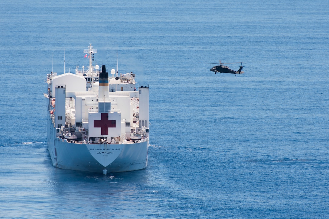 A UH-60 Blackhawk assigned to the 1st Battalion 228th Aviation Regiment approaches the U.S. Naval Ship Comfort during deck landing qualifications July 20, 2019, off the coast of Punta Arenas Costa Rica. U.S. Army Helicopter pilots and crew members of Joint Task Force –Bravo completed qualifications July 18-26 to support an upcoming mission, off the coast of Punta Arenas, Costa Rica. (U.S. Air Force photo by Staff Sgt. Eric Summers Jr.)