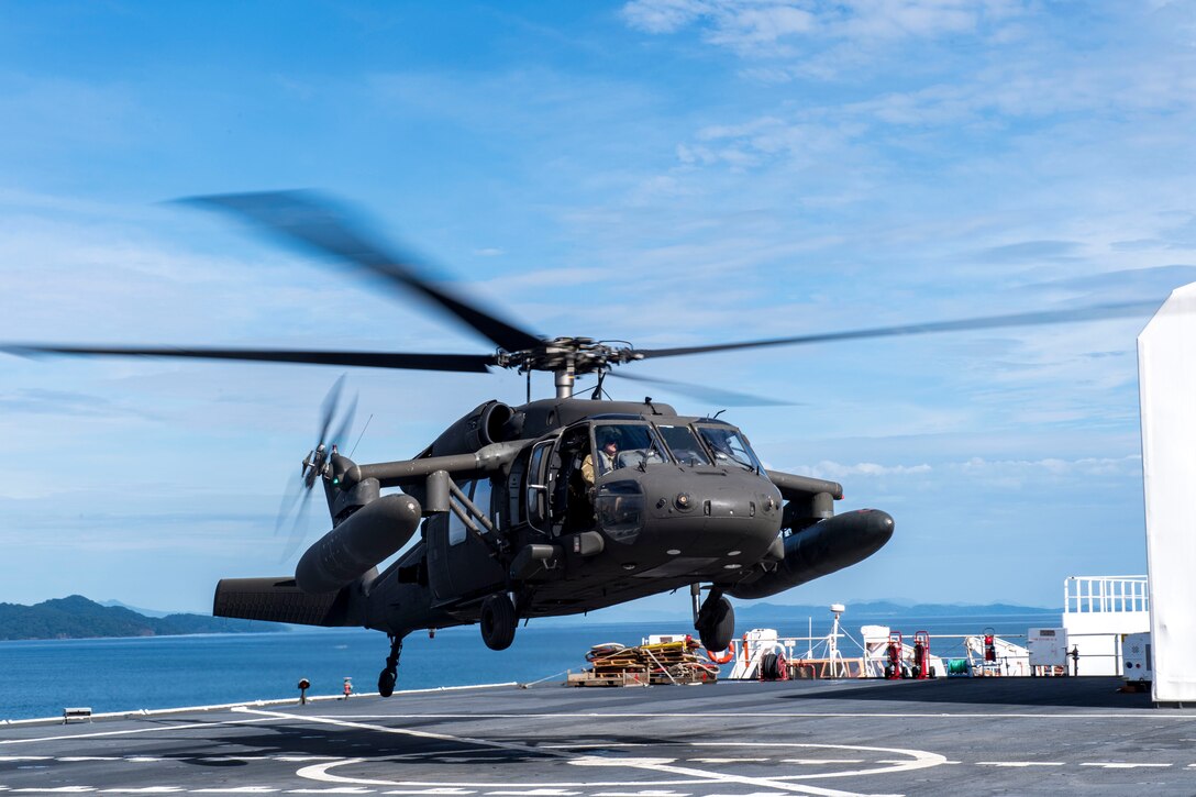 A UH-60 Blackhawk assigned to the 1st Battalion 228th Aviation Regiment completes a bounce off the U.S. Naval Ship Comfort during deck landing qualifications July 26, 2019, off the coast of Punta Arenas Costa Rica. U.S. Army Helicopter pilots and crew members of Joint Task Force –Bravo completed qualifications July 18-26 to support an upcoming mission, off the coast of Punta Arenas, Costa Rica. (U.S. Air Force photo by Staff Sgt. Eric Summers Jr.)
