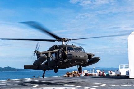 A UH-60 Blackhawk assigned to the 1st Battalion 228th Aviation Regiment completes a bounce off the U.S. Naval Ship Comfort during deck landing qualifications July 26, 2019, off the coast of Punta Arenas Costa Rica. U.S. Army Helicopter pilots and crew members of Joint Task Force –Bravo completed qualifications July 18-26 to support an upcoming mission, off the coast of Punta Arenas, Costa Rica. (U.S. Air Force photo by Staff Sgt. Eric Summers Jr.)