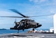 A UH-60 Blackhawk assigned to the 1st Battalion 228th Aviation Regiment completes a bounce off the U.S. Naval Ship Comfort during deck landing qualifications July 26, 2019, off the coast of Punta Arenas Costa Rica. U.S. Army Helicopter pilots and crew members of Joint Task Force –Bravo completed qualifications July 18-26 to support an upcoming mission, off the coast of Punta Arenas, Costa Rica. (U.S. Air Force photo by Staff Sgt. Eric Summers Jr.)