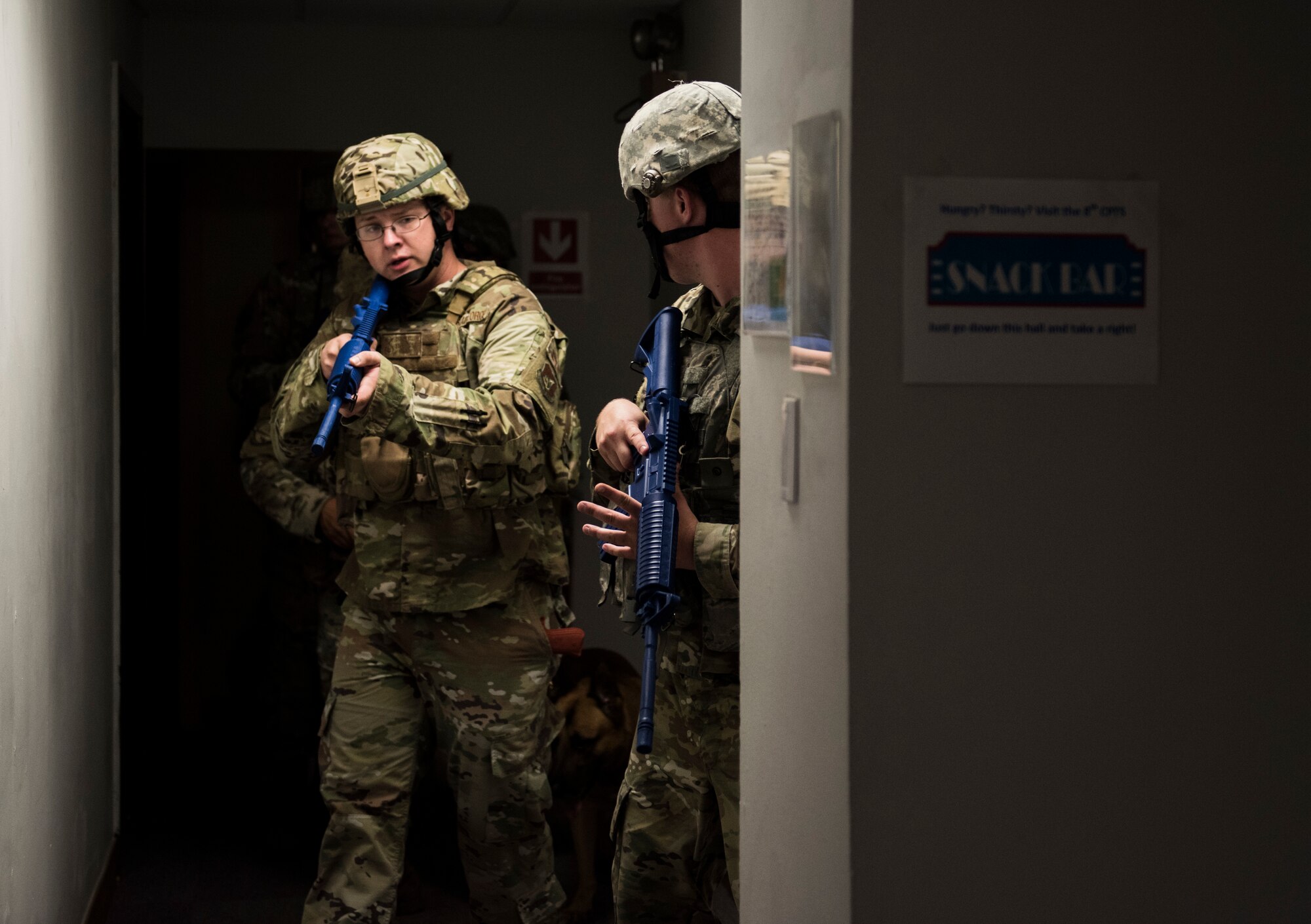 Members of the 8th Security Forces Squadron clear a building during an exercise at Kunsan Air Base, Republic of Korea, July 23, 2019. 8th SFS routinely trains to respond to a variety of threats. (U.S. Air Force photo by Senior Airman Stefan Alvarez)