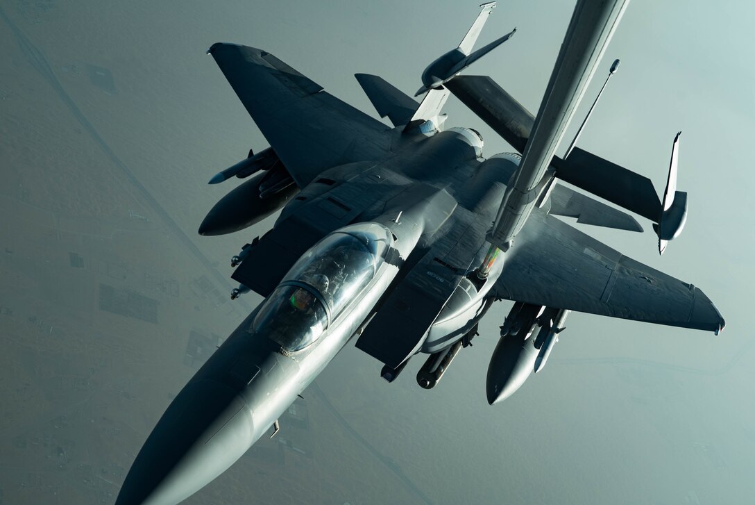 An F-15E Strike Eagle assigned to the 336th Expeditionary Fighter Squadron refuels from a KC-10 Extender June 27, 2019, at an undisclosed location during a surface combat air patrol mission. The F-15Es are currently supporting SuCAP missions for maritime transportation in the Arabian Gulf. (U.S. Air Force photo by Staff Sgt. Erin Piazza)