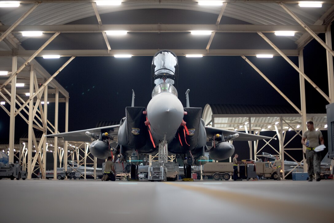 An F-15E Strike Eagle  sits while waiting for an upcoming mission July 15, 2019, at Al Dhafra Air Base, United Arab Emirates. The F-15E is a dual-role fighter designed to perform air-to-air and air-to-ground missions and is currently supporting surface combat air patrol operations in the Arabian Gulf. (U.S. Air Force photo by Staff Sgt. Chris Thornbury)