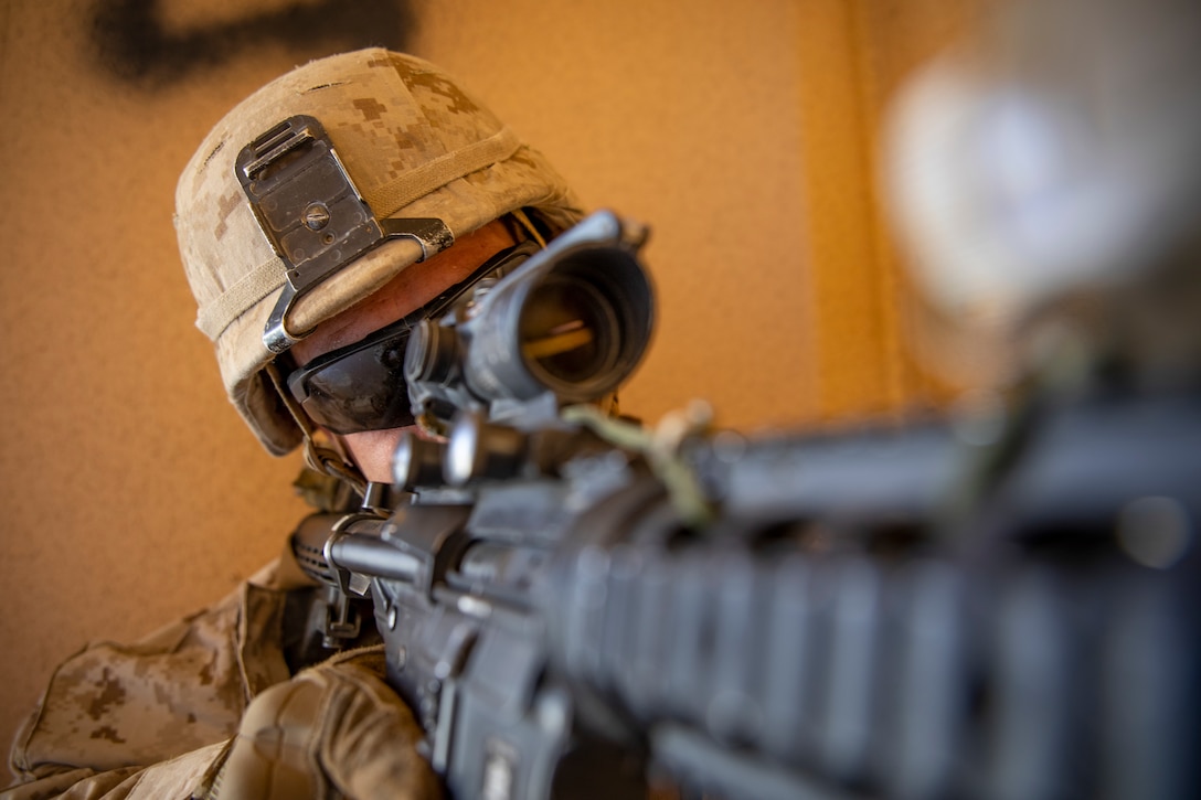 U.S. Marine Corps Sgt. Greg Whittaker, a rifleman with 1st Battalion, 25th Marine Regiment, 4th Marine Division, looks through his rifle scope at Marine Corps Air Ground Combat Center Twentynine Palms, Calif., July 30, 2019, during Integrated Training Exercise 5-19. ITX 5-19 is an essential component of the Marine Forces Reserve training and readiness cycle. It serves as the principle exercise for assessing a unit’s capabilities. (U.S. Marine Corps photo by Sgt. Andy O. Martinez)