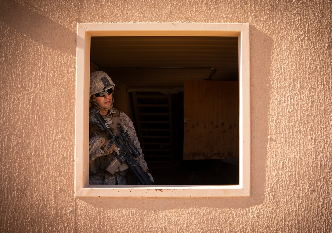 A U.S. Marine with 1st Battalion, 25th Marine Regiment, 4th Marine Division, posts security near a window at Marine Corps Air Ground Combat Center Twentynine Palms, Calif., July 30, 2019, during Integrated Training Exercise 5-19. ITX 5-19 is an essential component of the Marine Forces Reserve training and readiness cycle. It serves as the principle exercise for assessing a unit’s capabilities. (U.S. Marine Corps photo by Sgt. Andy O. Martinez)