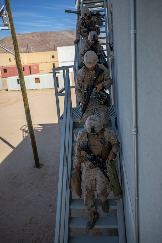 U.S. Marines with 1st Battalion, 25th Marine Regiment, 4th Marine Division, exit a building at Marine Corps Air Ground Combat Center Twentynine Palms, Calif., July 30, 2019, during Integrated Training Exercise 5-19. ITX 5-19 is an essential component of the Marine Forces Reserve training and readiness cycle. It serves as the principle exercise for assessing a unit’s capabilities. (U.S. Marine Corps photo by Sgt. Andy O. Martinez)