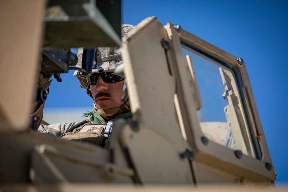 A U.S. Marine with 1st Battalion, 25th Marine Regiment, 4th Marine Division, uses a .50-caliber machine gun mounted on a Humvee to patrol at Marine Corps Air Ground Combat Center Twentynine Palms, Calif., July 30, 2019, during Integrated Training Exercise 5-19. ITX 5-19 is an essential component of the Marine Forces Reserve training and readiness cycle. It serves as the principle exercise for assessing a unit’s capabilities. (U.S. Marine Corps photo by Sgt. Andy O. Martinez)