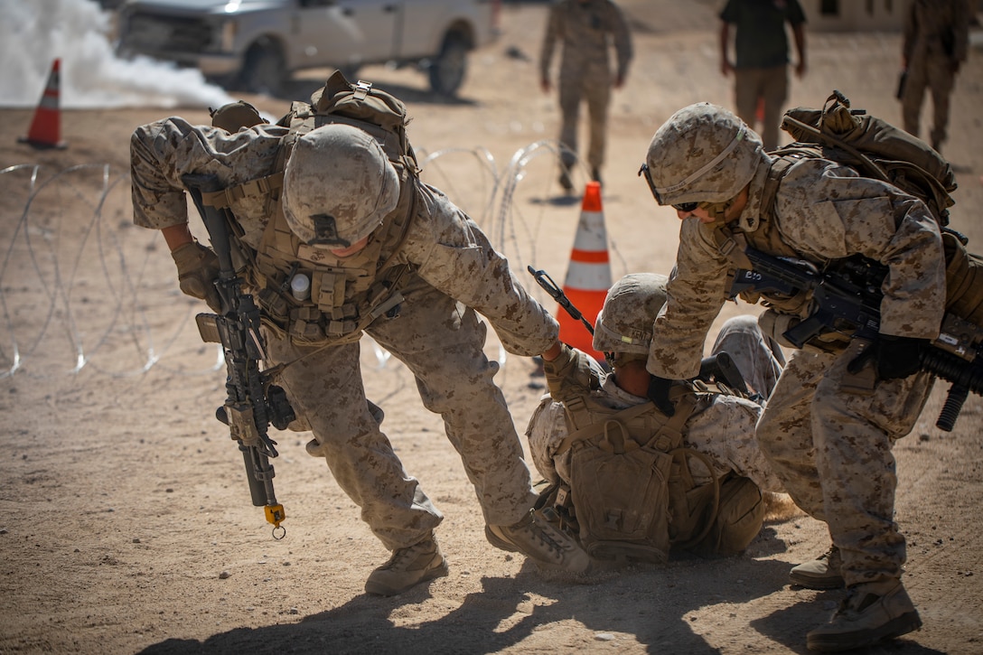 Two U.S. Marines with 1st Battalion, 25th Marine Regiment, 4th Marine Division, drag a Marine casualty to safety at Marine Corps Air Ground Combat Center Twentynine Palms, Calif., July 30, 2019, during Integrated Training Exercise 5-19. ITX 5-19 is an essential component of the Marine Forces Reserve training and readiness cycle. It serves as the principle exercise for assessing a unit’s capabilities. (U.S. Marine Corps photo by Sgt. Andy O. Martinez)