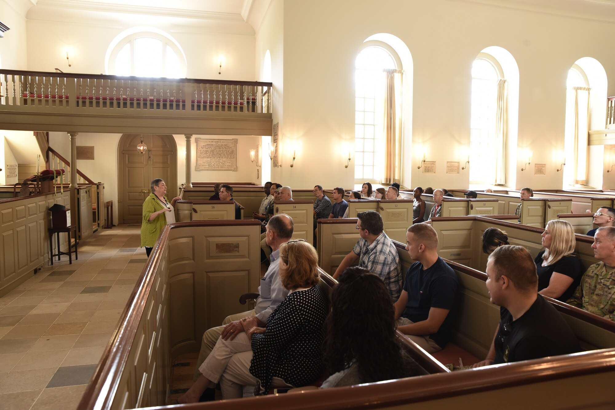 Marcia Hibbits, Bruton Parish Church guide, speaks to attendees during the 244th Chaplain Corps Anniversary celebration event in Williamsburg, Virginia, July 26, 2019.