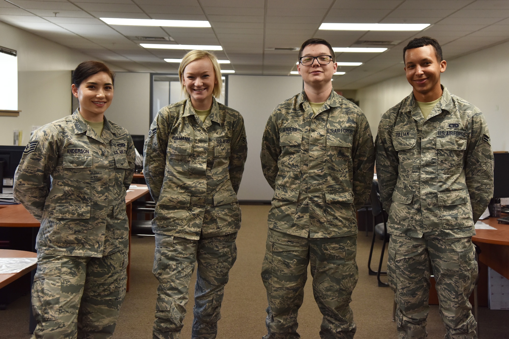 The traffic management personal property office flight poses for a picture July 29, 2019 at Malmstrom Air Force Base, Mont. traffic management office.