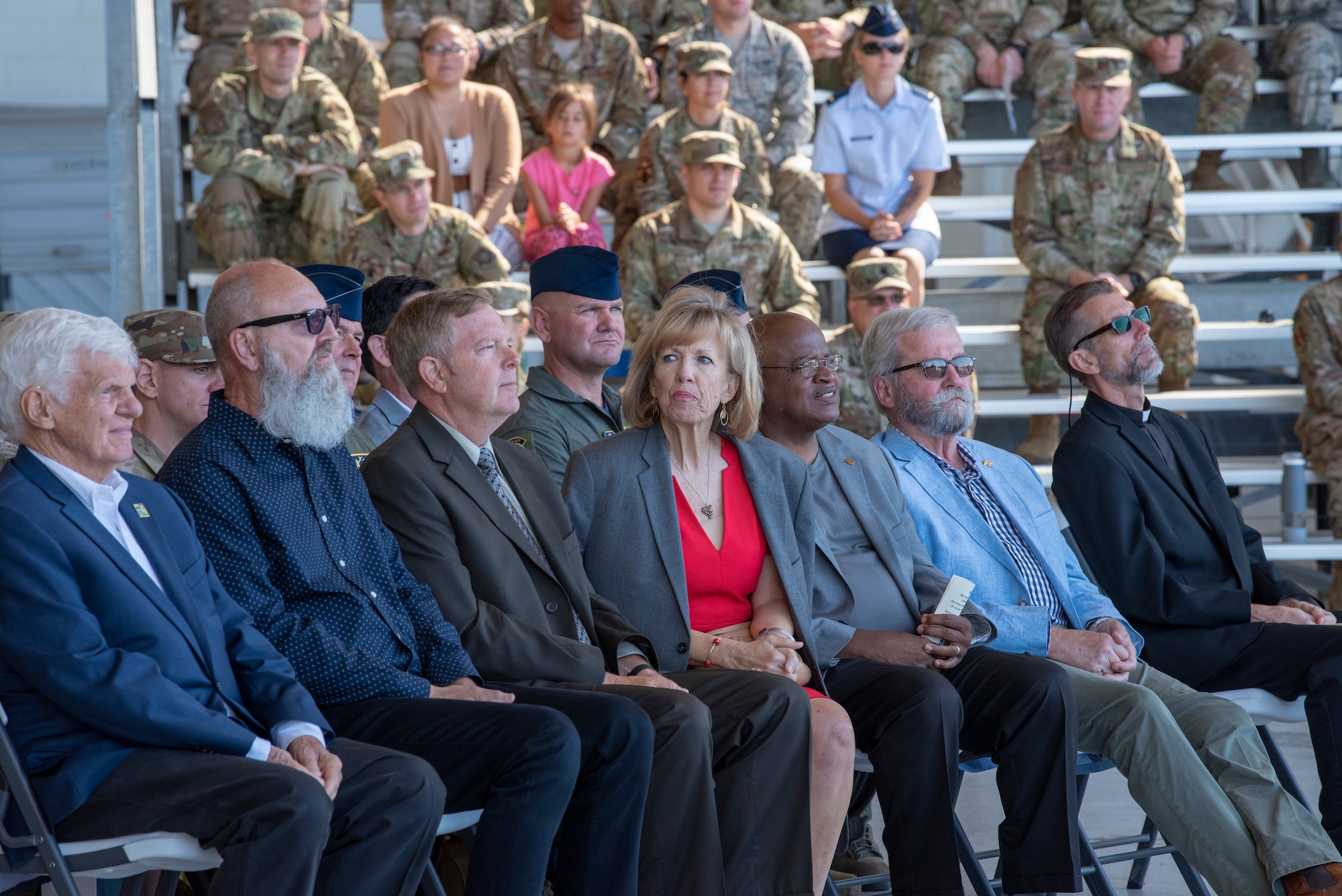 Community leaders from Solano County and members of Team Travis listen to speeches during the 60th Operations Group change of command ceremony July 26, 2019, at Travis Air Force Base, California. During the ceremony, U.S. Air Force Col. Theresa Weems, outgoing 60th OG commander, transferred command to Col. Gregg Johnson. (U.S. Air Force photo by Tech. Sgt. James Hodgman)