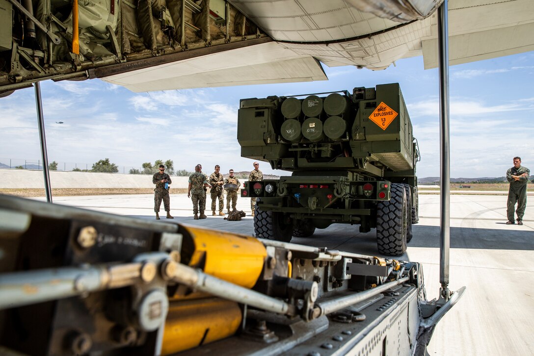 U.S. Marines with Sierra Battery, 5th Battalion, 11th Marine Regiment, 1st Marine Division, load an M142 High Mobility Artillery Rocket System into a KC-130J Hercules during Summer Fire Exercise 19 at Marine Corps Air Station Camp Pendleton, California, July 23, 2019. The Marines are conducting Summer FIREX, a live-fire regimental-level exercise, from July 22 to Aug. 1. The exercise is designed to bring the entire regiment together and maximize the training areas available on Camp Pendleton to enhance their ability to conduct real-world operations. (U.S. Marine Corps photo by Lance Cpl. Alison Dostie)