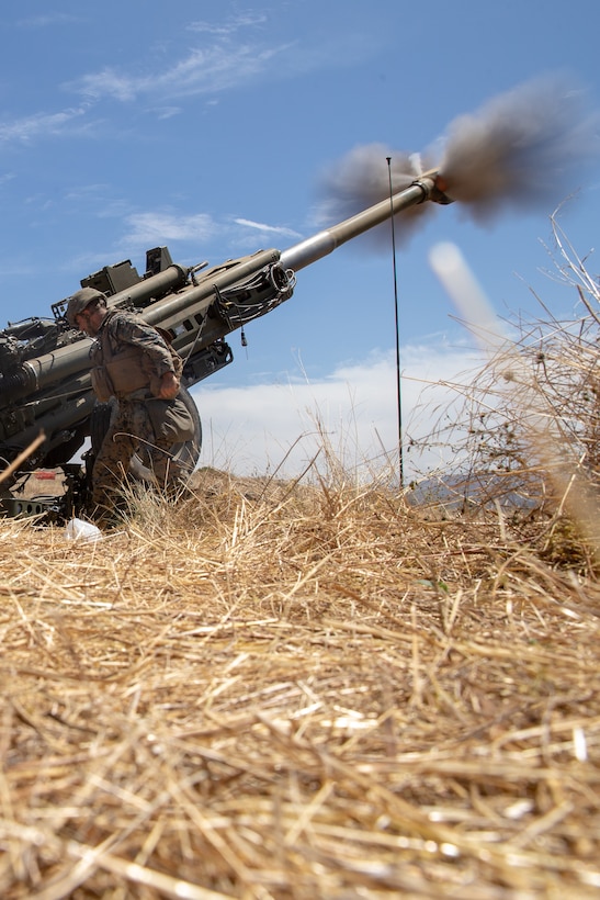 A U.S. Marine with Fox Battery, 2nd Battalion, 11th Marine Regiment, 1st Marine Division, fires an M777 howitzer during Summer Fire Exercise 19 at 62 Area on Marine Corps Base Camp Pendleton, California, July 23, 2019. The Marines are conducting Summer FIREX, a live-fire regimental-level exercise, from July 22 to Aug. 1. The exercise is designed to bring the entire regiment together and maximize the training areas available on Camp Pendleton to enhance their ability to conduct real-world operations.