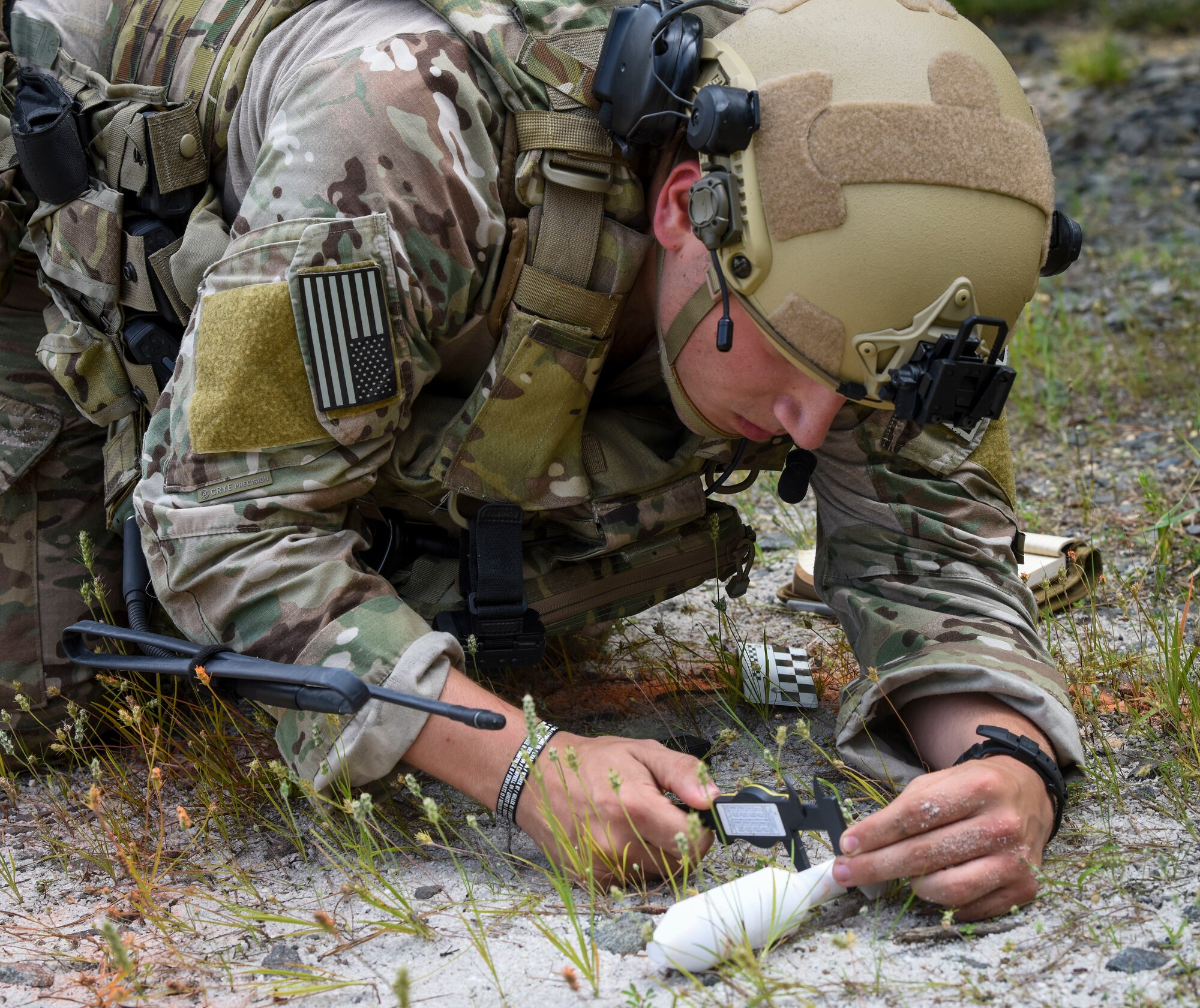 U.S. Air Force Airman 1st Class Russell Bongiovanni, 177th Civil Engineer Squadron Explosive Ordnance Disposal technician from the New Jersey Air National Guard, measures a simulated unidentified explosive ordnance during the Cerulean Raptor field training exercise, July 10, 2019 at Joint Base McGuire-Dix-Lakehurst, New Jersey. The 87th CES EOD flight’s week-long exercise hosted flights from the 177th CES EOD out of New Jersey Air National Guard, the 166th CES EOD flight from Delaware Air National Guard, the 436th CES EOD flight from Dover Air Force Base, Delaware, the 633rd CES EOD flight out of Joint Base Langley-Eustis, Virginia and a team from NATO partner, Albania. (U.S. Air Force photo by Staff Sgt. AJ Hyatt)