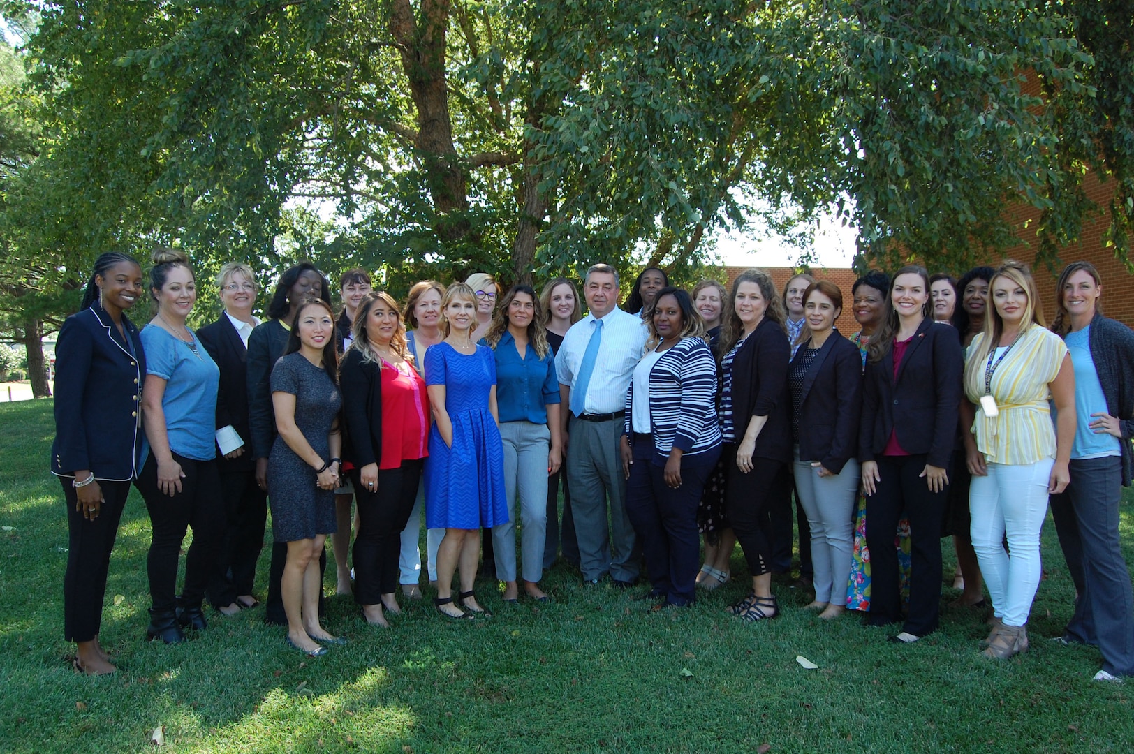 Group shot of employees standing outside