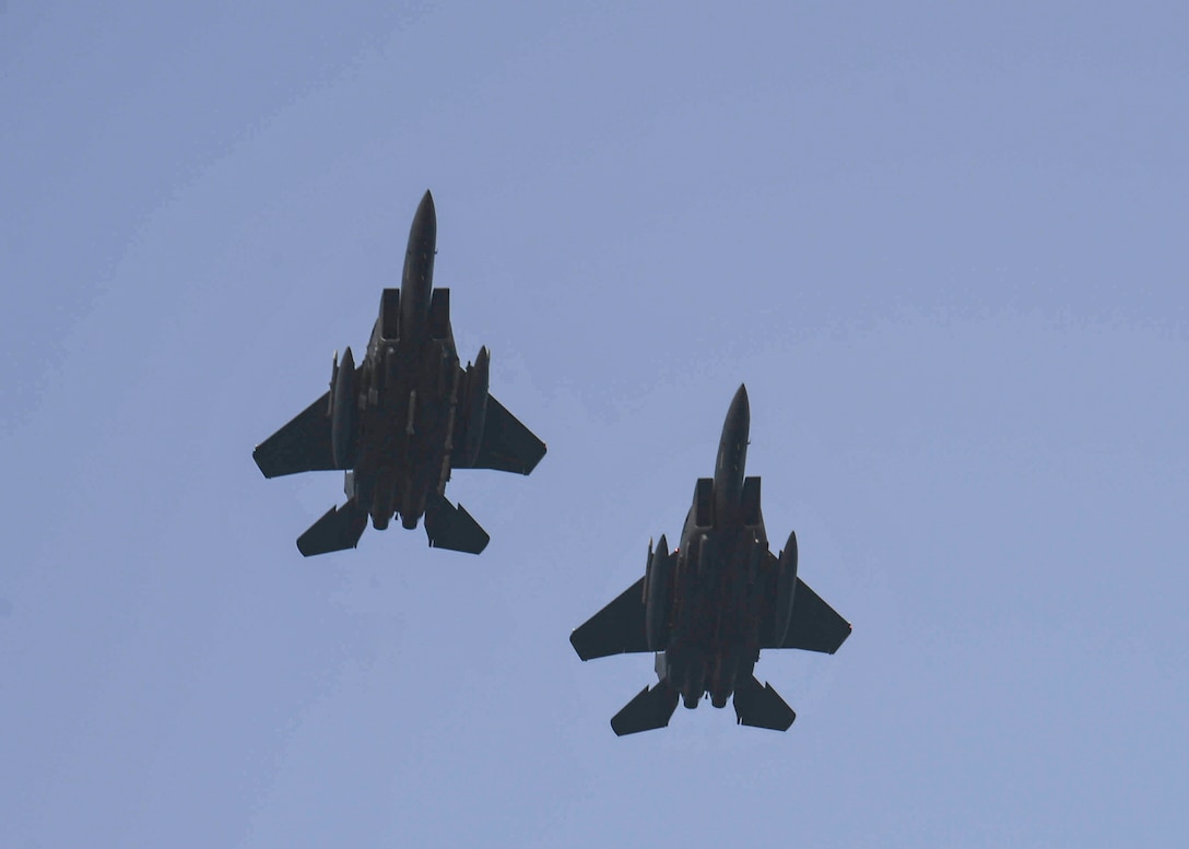Two F-15E Strike Eagles fly over the Arleigh Burke-class guided-missile destroyer USS Gonzalez (DDG 66) during during an Aircraft Operations in Maritime and Surface Warfare exercise, July 24, 2019. Gonzalez is deployed to the U.S. 5th Fleet area of operations in support of naval operations to ensure maritime stability and security in the Central Region, connecting the Mediterranean and the Pacific through the Western Indian Ocean and three strategic choke points. (U.S. Navy photo by Mass Communication Specialist 3rd Class Maxwell Anderson/Released)
