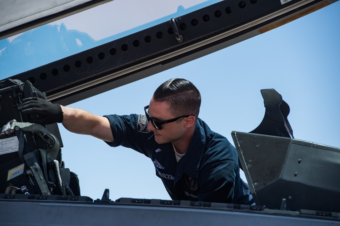 U.S. Air Force Staff Sgt. Lenny Buscemi, 94th Aircraft Maintenance Unit dedicated crew chief, prepares an F-22 Raptor before takeoff at Nellis Air Force Base, Nevada, July 18, 2019.