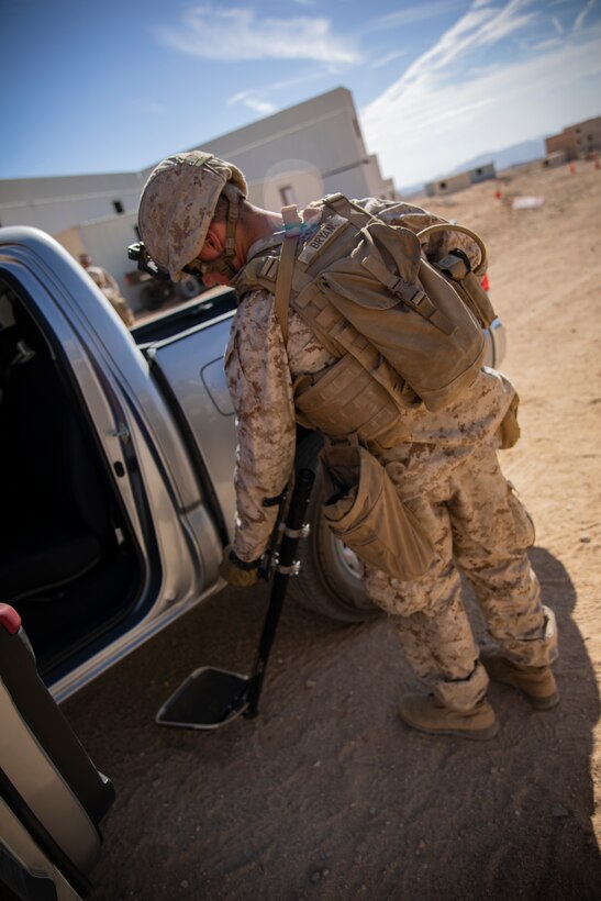 A U.S. Marine with 1st Battalion, 25th Marine Regiment, 4th Marine Division, uses a mirror to inspect a vehicle at Marine Corps Air Ground Combat Center Twentynine Palms, Calif., July 30, 2019, during Integrated Training Exercise 5-19. ITX 5-19 is an essential component of the Marine Forces Reserve training and readiness cycle. It serves as the principle exercise for assessing a unit’s capabilities. (U.S. Marine Corps photo by Sgt. Andy O. Martinez)