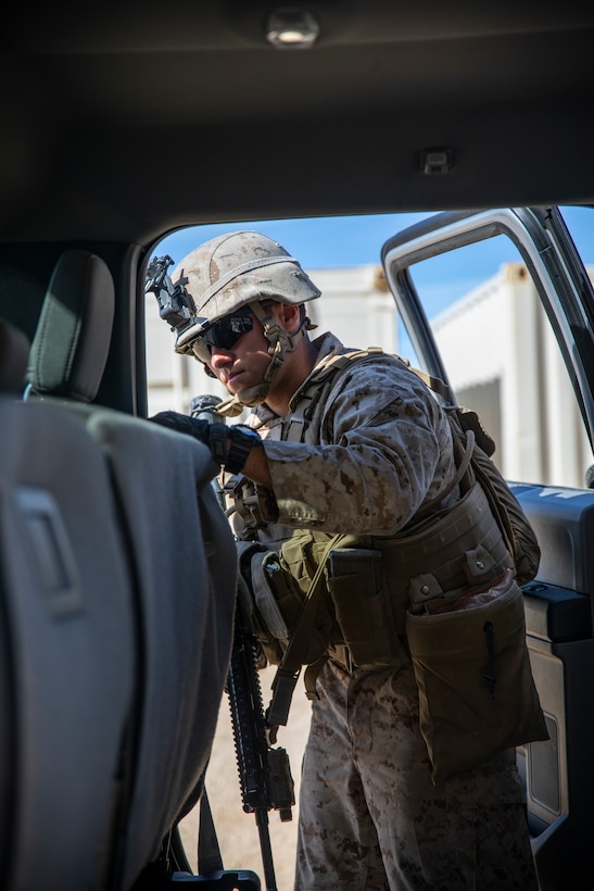 A U.S. Marine with 1st Battalion, 25th Marine Regiment, 4th Marine Division, inspects a vehicle at Marine Corps Air Ground Combat Center Twentynine Palms, Calif., July 30, 2019, during Integrated Training Exercise 5-19. ITX 5-19 is an essential component of the Marine Forces Reserve training and readiness cycle. It serves as the principle exercise for assessing a unit’s capabilities. (U.S. Marine Corps photo by Sgt. Andy O. Martinez)