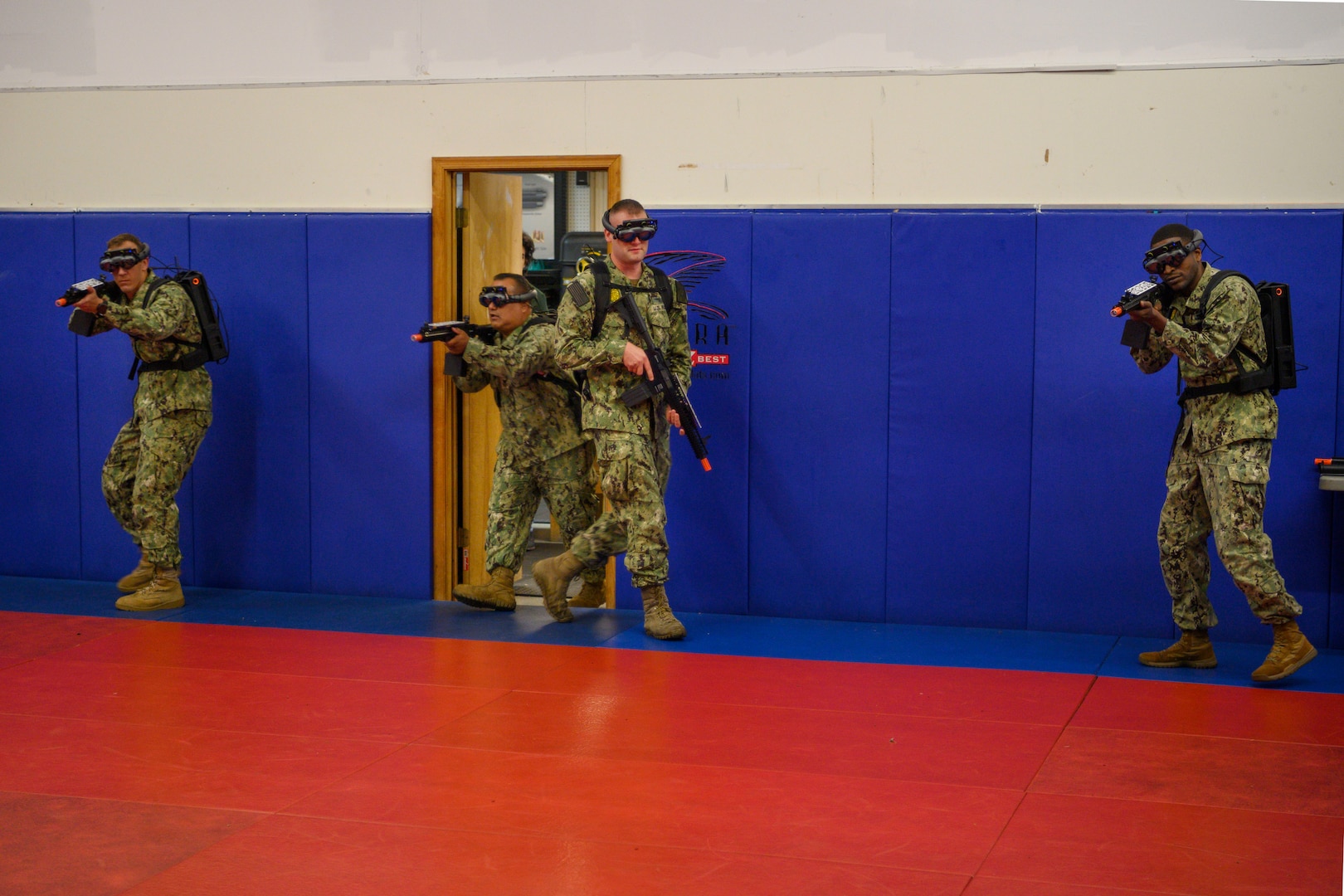 IMAGE: 190613-N-PO203-0082 CHESAPEAKE, Virginia (Jun. 13, 2019) Sailors assigned to the Center for Security Forces detachment in Chesapeake, Va., demonstrate the Office of Naval Research Global (ONRG) TechSolutions-sponsored Tactically Reconfigurable Artificial Combat Enhanced Reality (TRACER) system. TechSolutions partnered with Naval Surface Warfare Center Dahlgren Division to develop the TRACER package, which consists of a virtual-reality headset, a backpack, a state-of-the-art simulated weapon designed to deliver realistic recoil, and a software package that creates multiple and adaptable simulation scenarios for security personnel to experience. ONRG TechSolutions allows Sailors and Marines to submit technology requests directly to the development community for rapid response prototyping. (U.S. Navy photo by John F. Williams)