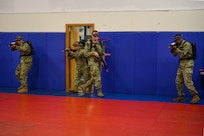 IMAGE: 190613-N-PO203-0082 CHESAPEAKE, Virginia (Jun. 13, 2019) Sailors assigned to the Center for Security Forces detachment in Chesapeake, Va., demonstrate the Office of Naval Research Global (ONRG) TechSolutions-sponsored Tactically Reconfigurable Artificial Combat Enhanced Reality (TRACER) system. TechSolutions partnered with Naval Surface Warfare Center Dahlgren Division to develop the TRACER package, which consists of a virtual-reality headset, a backpack, a state-of-the-art simulated weapon designed to deliver realistic recoil, and a software package that creates multiple and adaptable simulation scenarios for security personnel to experience. ONRG TechSolutions allows Sailors and Marines to submit technology requests directly to the development community for rapid response prototyping. (U.S. Navy photo by John F. Williams)