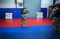 IMAGE: 190613-N-PO203-0186 CHESAPEAKE, Virginia (Jun. 13, 2019) Sailors assigned to the Center for Security Forces detachment in Chesapeake, Va., demonstrate the Office of Naval Research Global (ONRG) TechSolutions-sponsored Tactically Reconfigurable Artificial Combat Enhanced Reality (TRACER) system. TechSolutions partnered with Naval Surface Warfare Center Dahlgren Division to develop the TRACER package, which consists of a virtual-reality headset, a backpack, a state-of-the-art simulated weapon designed to deliver realistic recoil, and a software package that creates multiple and adaptable simulation scenarios for security personnel to experience. ONRG TechSolutions allows Sailors and Marines to submit technology requests directly to the development community for rapid response prototyping. (U.S. Navy photo by John F. Williams)