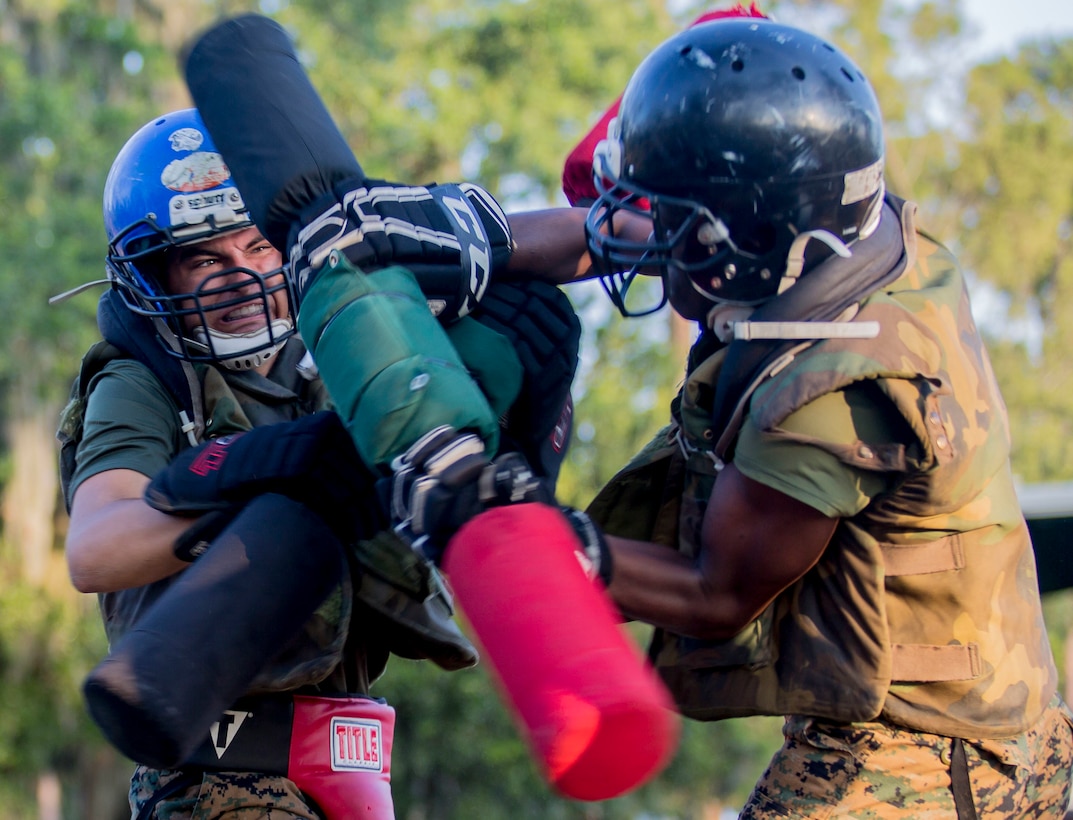 Recruits with Hotel Company, 2nd Recruit Training Battalion, engage pugil sticks at Marine Corps Recruit Depot Parris Island, S.C., July 31, 2019. Body sparring and pugil sticks help recruits apply the fundamentals of Marine Corps martial arts.