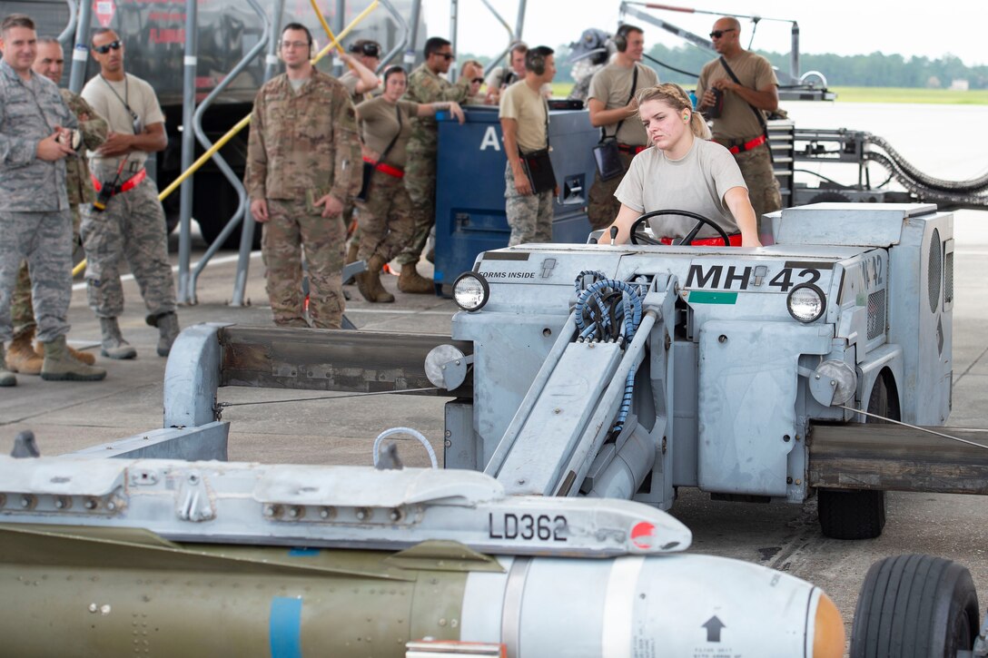 Airman 1st Class Reese DeAndrea, 75th Aircraft Maintenance Unit weapons load crew member, transports a munition during an integrated combat training, July 26, 2019, at Moody Air Force Base, Ga. The integrated combat training involved Airmen from several different specialties who worked simultaneously to refuel and upload munitions on to an A-10C Thunderbolt II. The training also allowed Airmen to gain experience quick-turning an aircraft, which helped increase their readiness in support of contingency missions. (U.S. Air Force photo by Airman Azaria E. Foster)