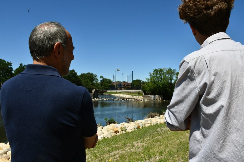 Mike Padilla (left), an engineer with the U.S. Army Corps of Engineers Chicago District, and Aiden Kelly, university student, look upon the site where the North Branch Dam in River Park once stood July 31, 2019. The four-foot high concrete dam at the convergence of the North Branch of the Chicago River and the North Shore Channel on Chicago’s north side was a barrier to healthy ecosystems and was removed by the Chicago District in 2018. (U.S. Army photo by Mariah Oliveras/Released)