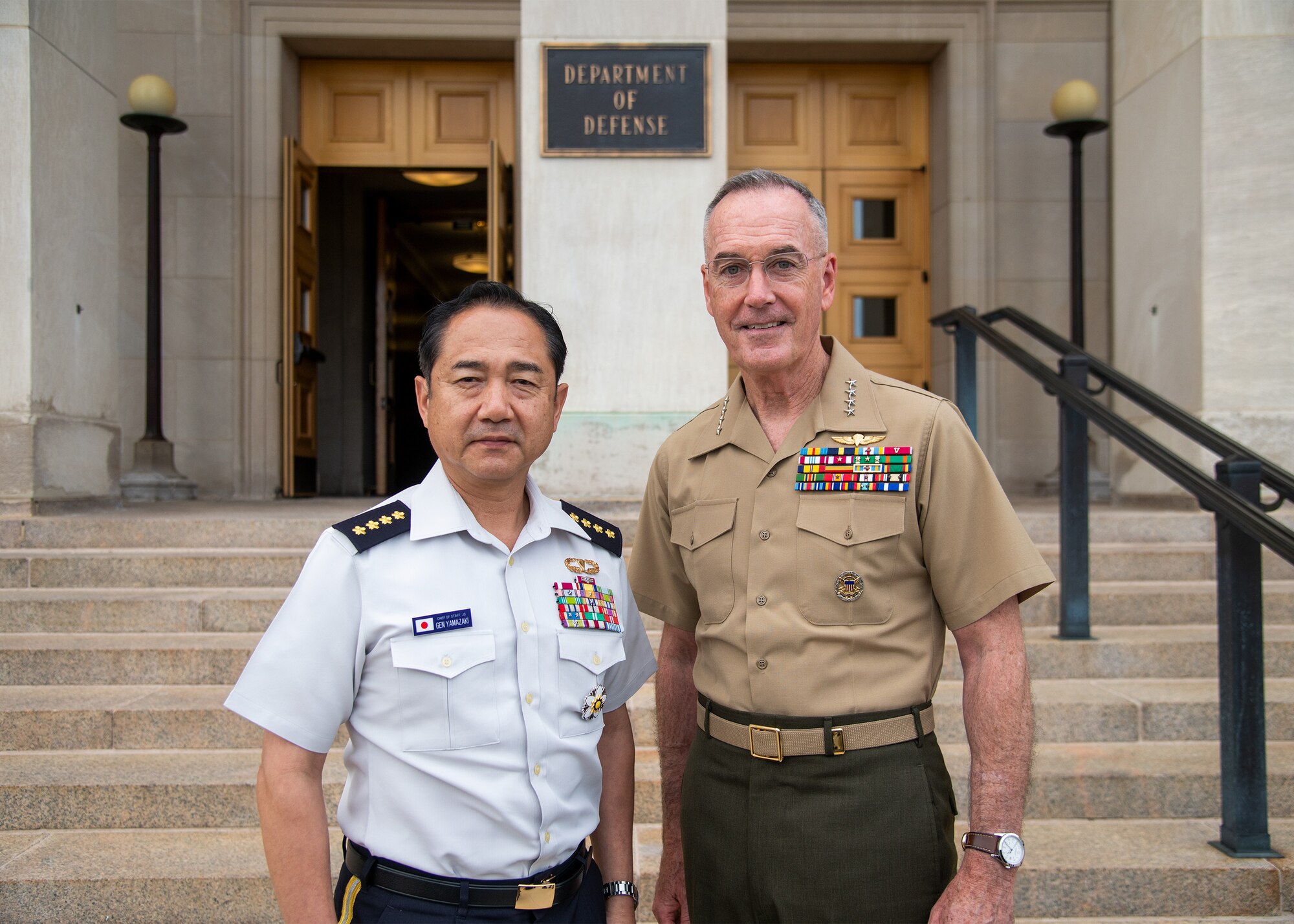 Chairman of the Joint Chiefs of Staff Gen. Joe Dunford poses for a photo with Chief of Staff, Joint Staff, Japan Self-Defense Forces, Gen. Koji Yamazaki outside the Pentagon, Washington D.C., July 31, 2019.