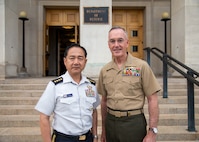 Chairman of the Joint Chiefs of Staff Gen. Joe Dunford poses for a photo with Chief of Staff, Joint Staff, Japan Self-Defense Forces, Gen. Koji Yamazaki outside the Pentagon, Washington D.C., July 31, 2019.