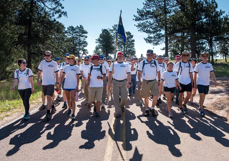 Basic cadets from the Class of 2023 marched back from Jacks Valley to the main Academy campus after completing field training July 31, 2019. Academy graduates were invited to march back with the cadets for the first time this year.   (U.S. Air Force photo/Joshua Armstrong)(U.S. Air Force photo/Trevor Cokley)